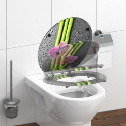 Toilettensitz mit Bambus- und Orchideenmotiv in geöffneter und geschlossener Darstellung.