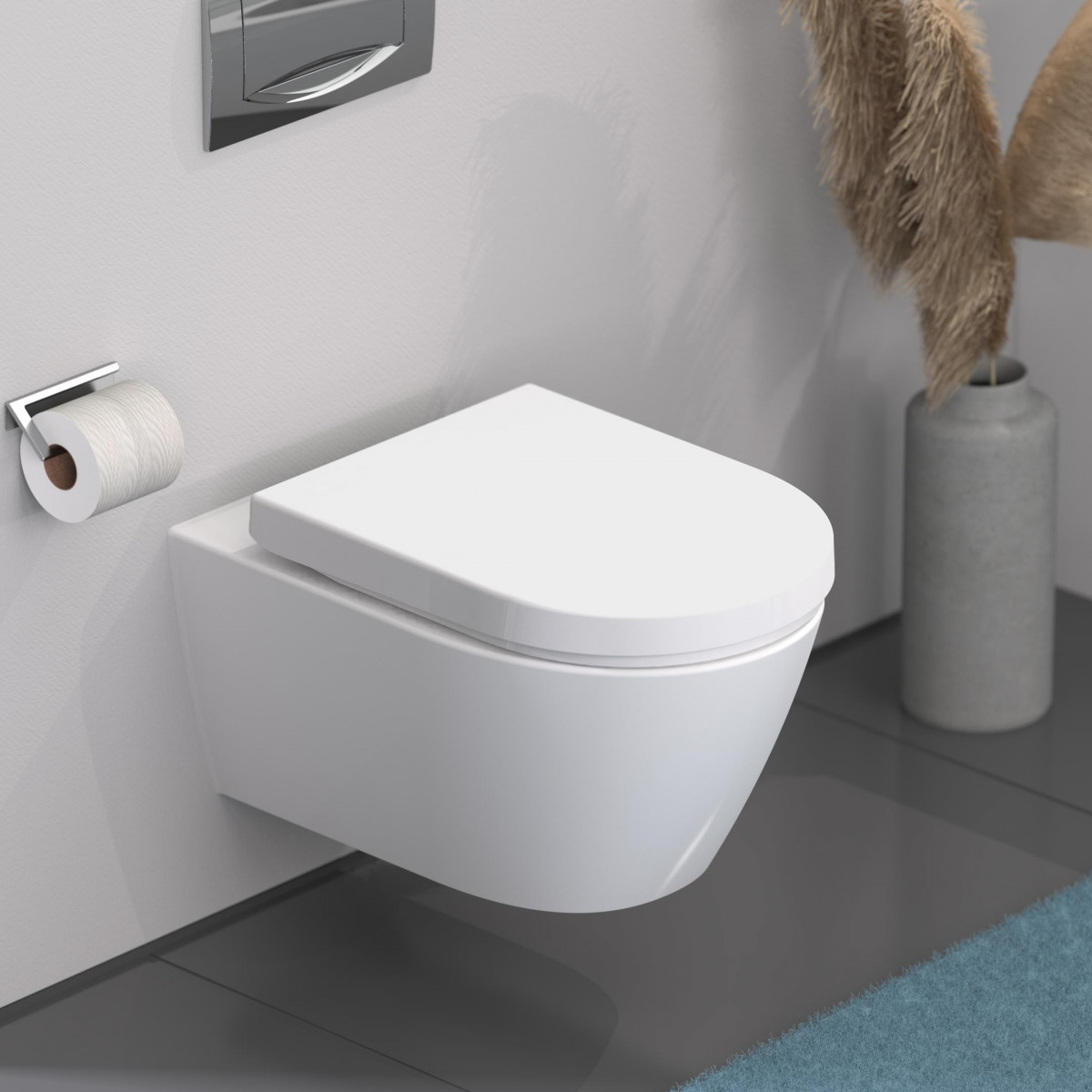 Wandhängendes WC mit geschlossenem Deckel und Toilettenpapierhalter an weißer Wand.