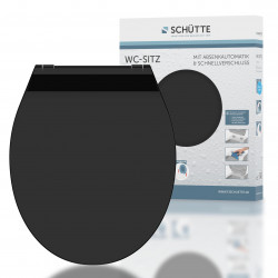 Schwarzer WC-Sitz mit Deckel, stehend vor Verpackung mit Herstelleraufdruck Schütte.